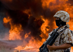 Mexican marine stands guard as 7,000 kilograms of marijuana are incinerated in Mexico's Sonora state.